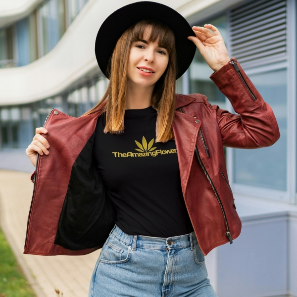 woman sitting on a pedestrian overpass wearing a black cannabinoid holiday tree hoodie in black