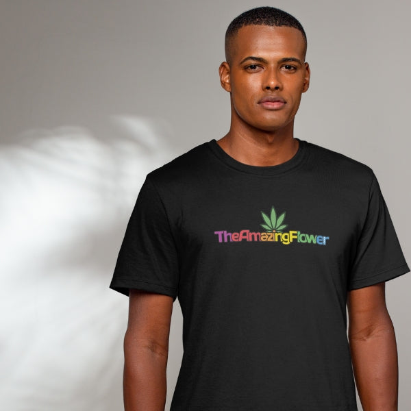Hemp Leaf Rainbow Logo T-Shirt worn by a black man looking at the camera with a beige background with sunlight