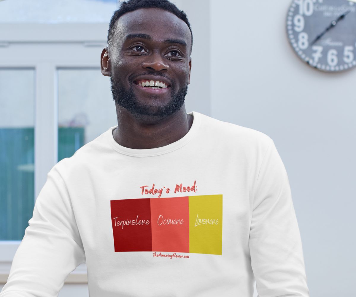 Man smiling and wearing a white 'Today's Mood: Energy' Terpenes T-shirt from TheAmazingFlower.com